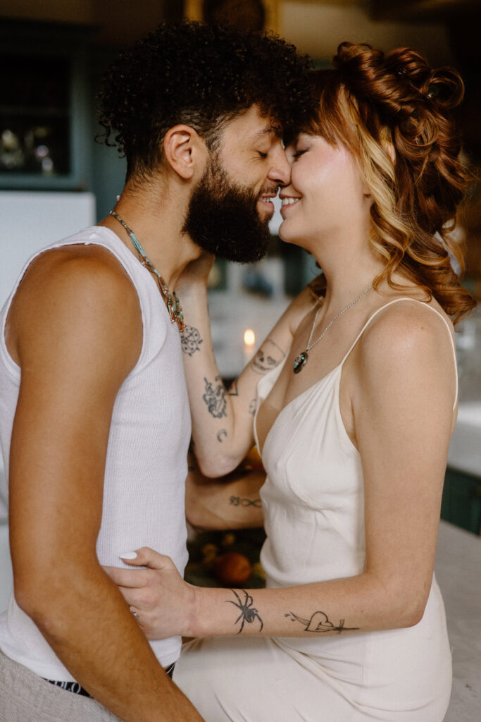 A close up photo of a couple kissing in a cabin before their Colorado elopement.