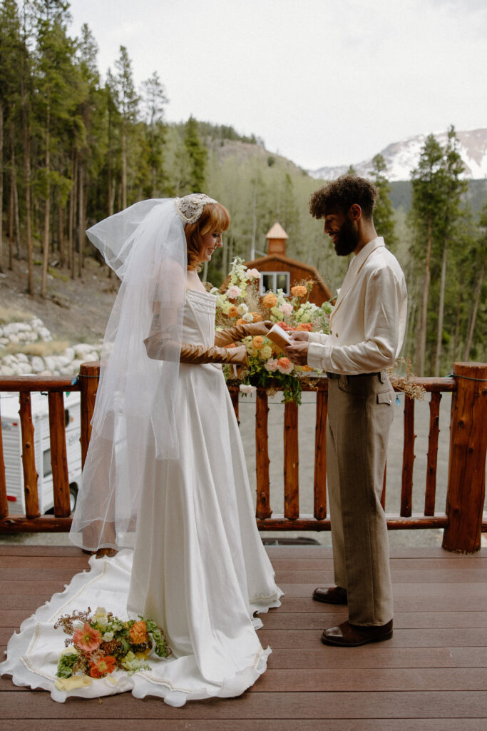 ntimate Colorado cabin elopement with the couple sharing vows and heartfelt promises.