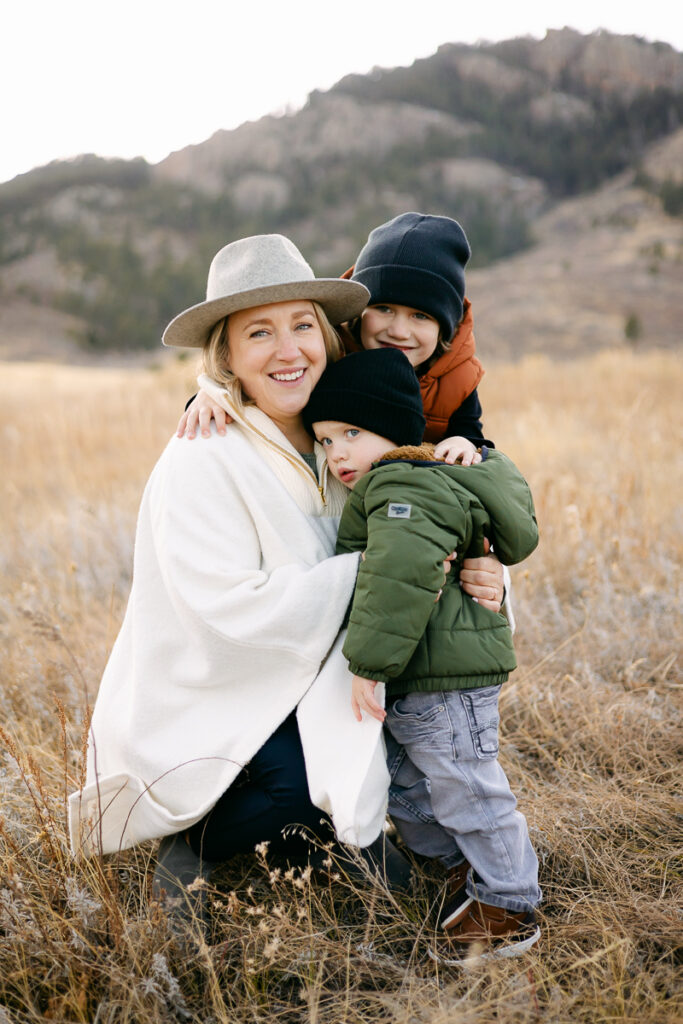 A mother embraces her sons in the fields of Lory State Park in Fort Collins, Colorado.