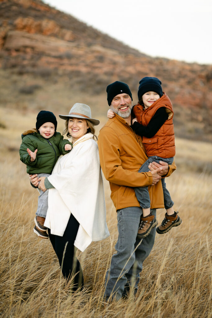 A family poses for a photo during their Family Photo Session in Fort Collins, Colorado.